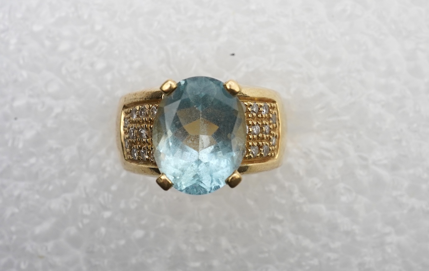 An aquamarine and diamond ring